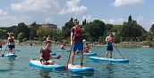 Tour guidato in SUP con gruppo che esplora Punta San Vigilio