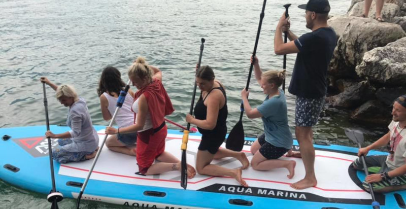 Partecipanti su Mega SUP sul Lago di Garda da Porto Tignale